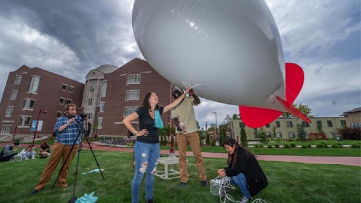 DU students working together to launch weather balloon